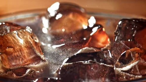 Ice Cubes Floating in Refreshing Brown Drink