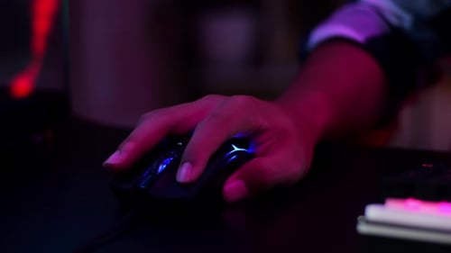 Close Up Of Pro Cyber Sport Gamer Play Game With Mouse