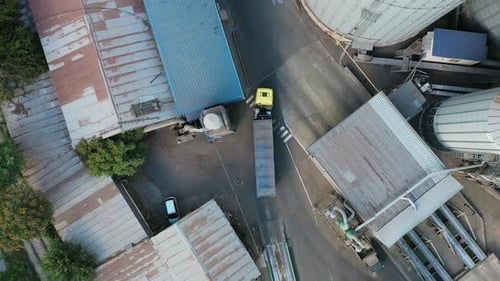 Aerial View From Above of Grain Lorry or Dump Truck Driving Through the Industrial Area of Grain