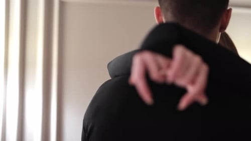 Loving Couple Embrace in Bright Indoor Setting