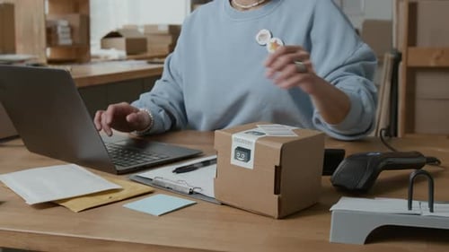 Office Worker Scanning Package at Desk