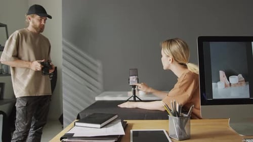 Woman Shooting Photos of Commercial Samples on Smartphone in Studio