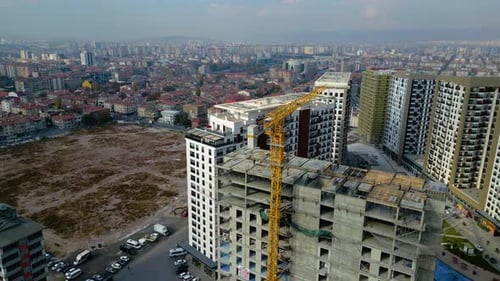 Tower crane working on a multi-story construction site