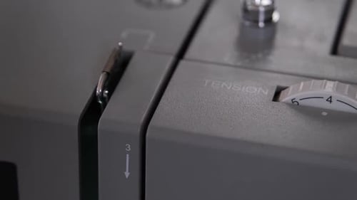 sewing machine working making rhythmic mechanical sounds