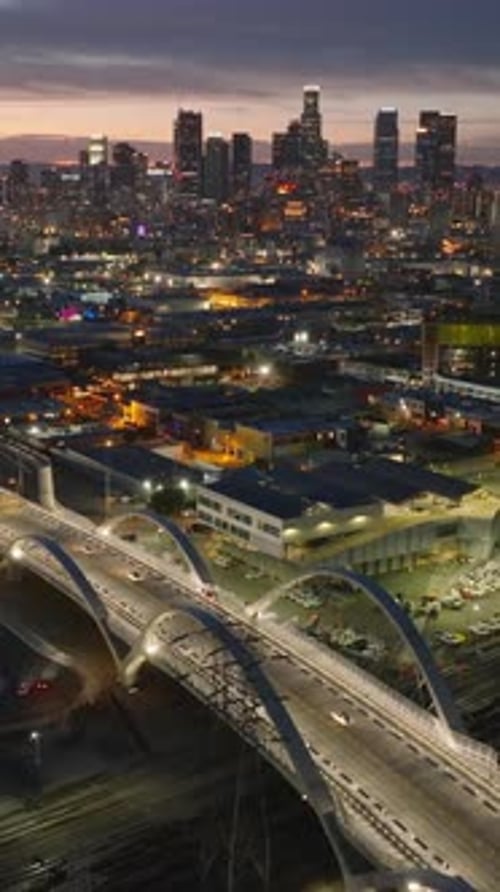 Aerial Footage of Evening Cityscape Backwards Reveal of Illuminated 6Th Street Viaduct Los Angeles