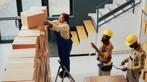 Team Working to Ship Packages in Warehouse