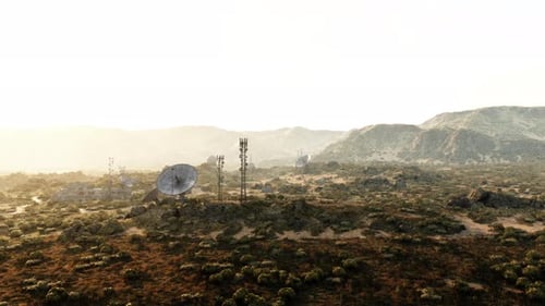 A Satellite Dish Standing Tall Amidst the Vastness of the Desert