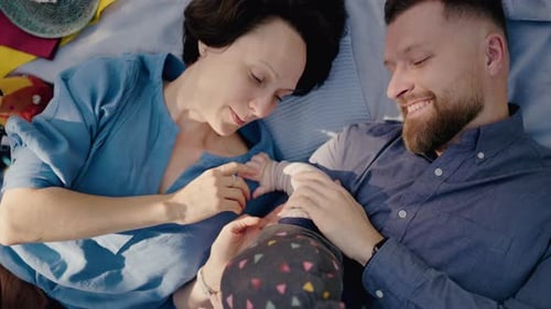 Happy Family Enjoying a Sunny Day at a Picnic in the Park
