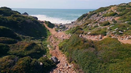 Drone View Stony Coast Washing by Beautiful Endless Ocean. Stunning Sea Waves