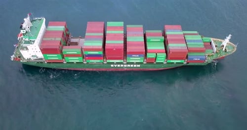 Container ship loaded with Shipping containers at sea