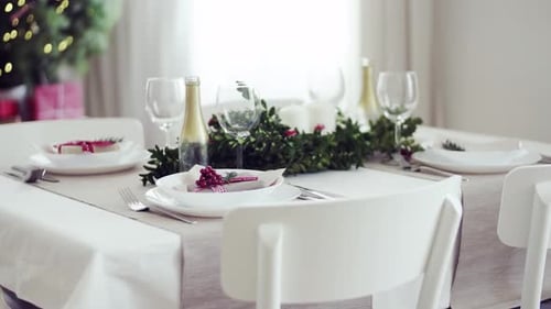 Christmas table setting with ornaments and decorations