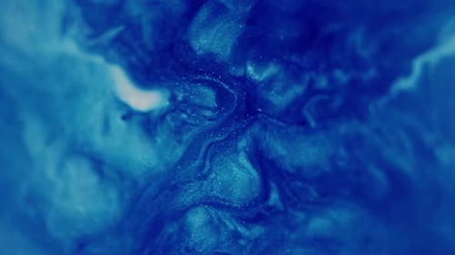 Abstract Swirling Sparkling Blue Liquid Close Up