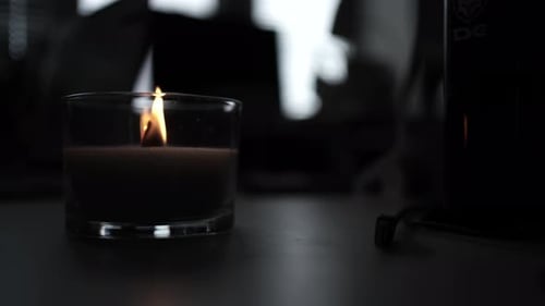 Candle light in the dark in church. Flickering Candle. Spiritual Atmosphere