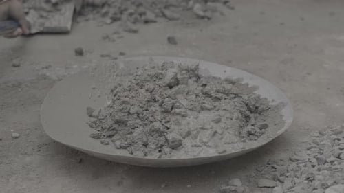 Concrete Being Mixed in Pan Construction Material