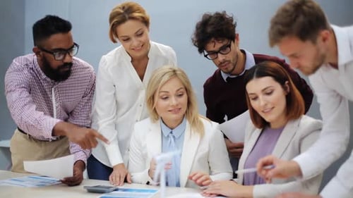 Green Renewable Energy, Teamwork, Corporate And People Concept - Business Team With Papers And Wi...