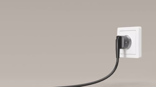 Cable is pulled out of white electric socket. Close up view. Save electricity