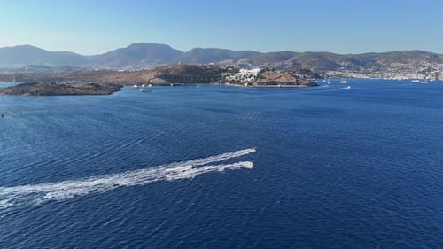 Speedboats Gliding Across the Turquoise Ocean