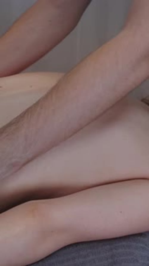 Massage in Clinic a Man Therapist Massaging Bare Back of