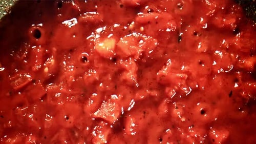 Simmering Tomato Sauce Close Up in Pan