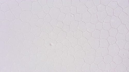 Aerial View of Cracked White Salt Flat Surface