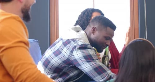 Friends Laughing Together Indoors