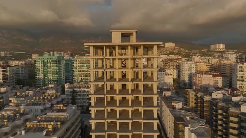 Aerial View A Beachfront Highrise Structure Reveals Its Framework Marking the Beginning of Luxury