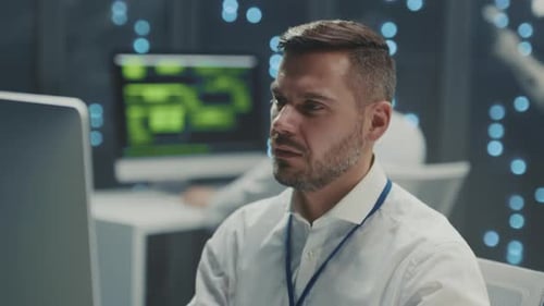 Technician Analyzing Data Computer Engineer Examining Network Activity with Advanced Monitoring