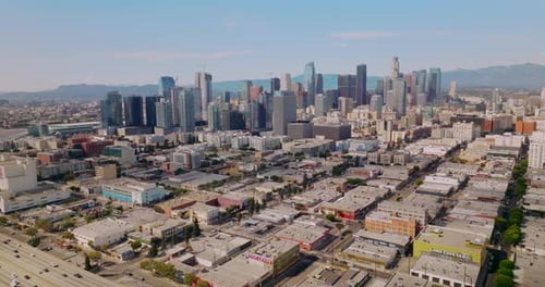 High buildings of amazing financial district in Los Angeles, USA. Hazy hills of California