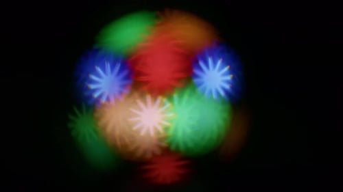 Abstract Colorful Starburst Lights on Dark Background