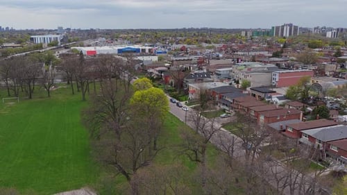 Bird's Eye Capturing Urban Park Suburban Houses Walmart Distant Cityscape on an Overcast Day