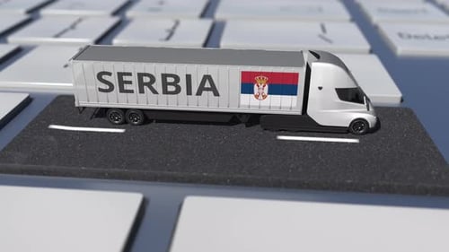 Flag of Serbia on Moving Truck and Computer Keyboard