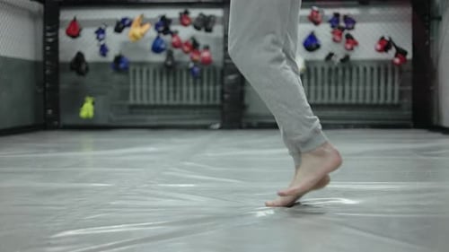 Close Up Feet of Caucasian Human Skipping with Jump Rope and Switching Legs