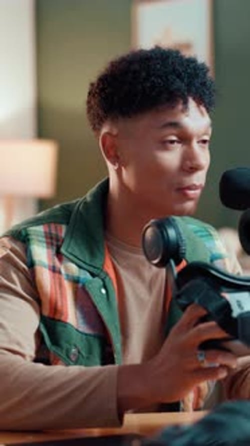 Microphone, podcast and man with review on headphones for advice, broadcast or social media