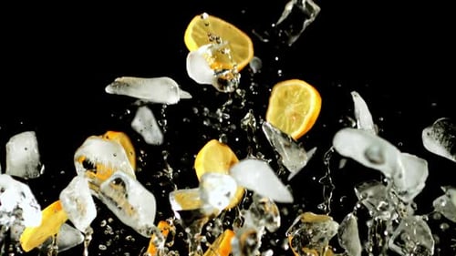 Pieces of Lemon and Ice Fly Up and Fall Down