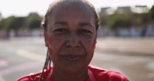 Happy african football fan celebrates champions victory outside stadium in qatar