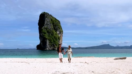 Couple Exploring the Stunning Beaches of Koh Poda in Krabi Thailand on a Sunny Day
