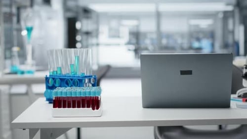 Science lab table with microscope and test tubes