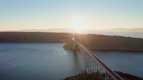 Drone shot of the bridge and ocean in the sunset 8