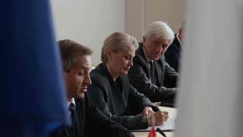 Officials at a Diplomatic Conference in Formal Business Attire
