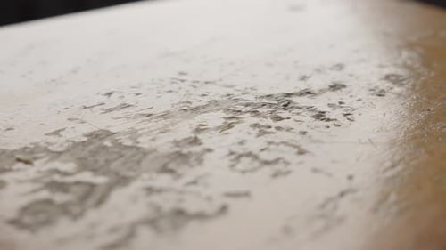 Close-up of a worn wooden surface with detailed textures and patterns