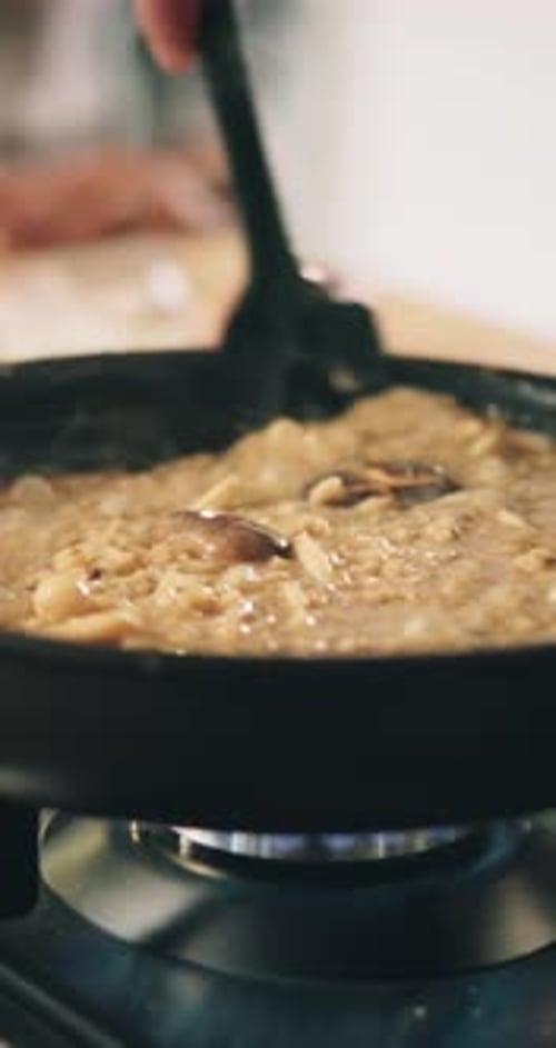 Cooking Food in Pan on Stove