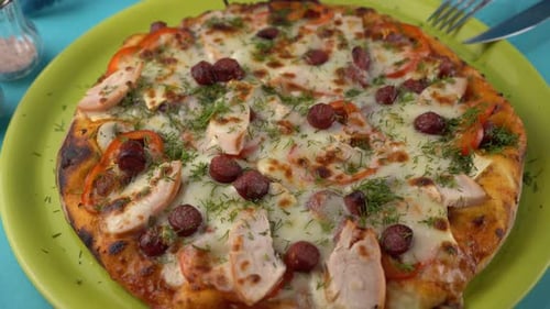 Overhead Shot of Fresh Chicken Pizza on Green Plate