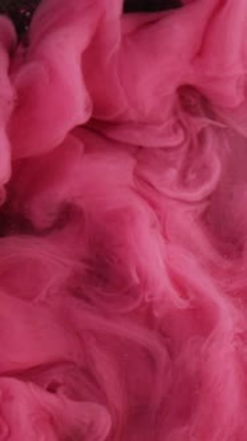 Pink Paint Flowing into Dark Glitter Substance