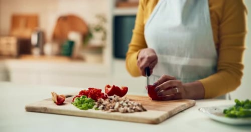 Woman Chopping Vegetables in Home Kitchen
