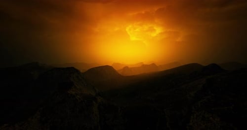 Dramatic Golden Sunset Over Dark Mountain Landscape