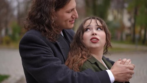 Romantic Couple Embracing in the Park