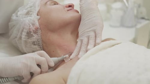Cosmetic Surgery on Woman's Neck in Hospital