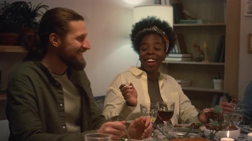 Friends and Family Sharing a Meal Together