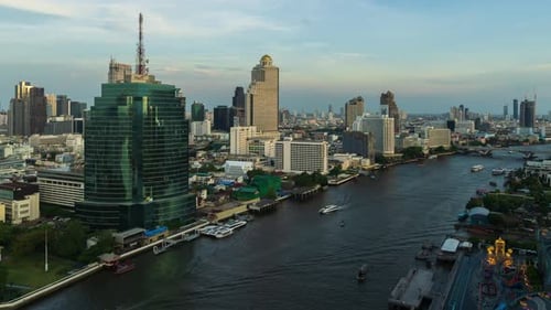 day to night time lapse of Chao Phraya River with King Taksin bridge and building of Bangkok city