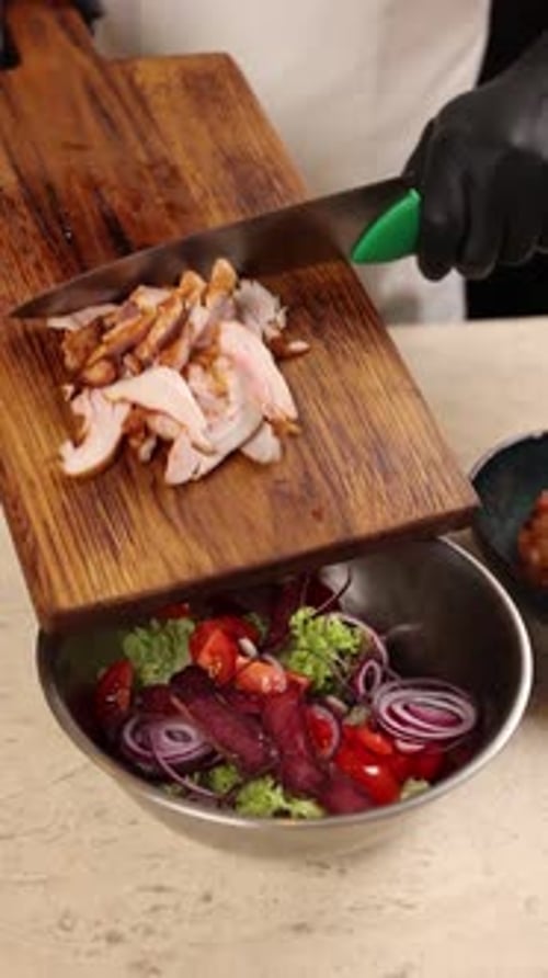 Chef prepares a delicious salad in a restaurant